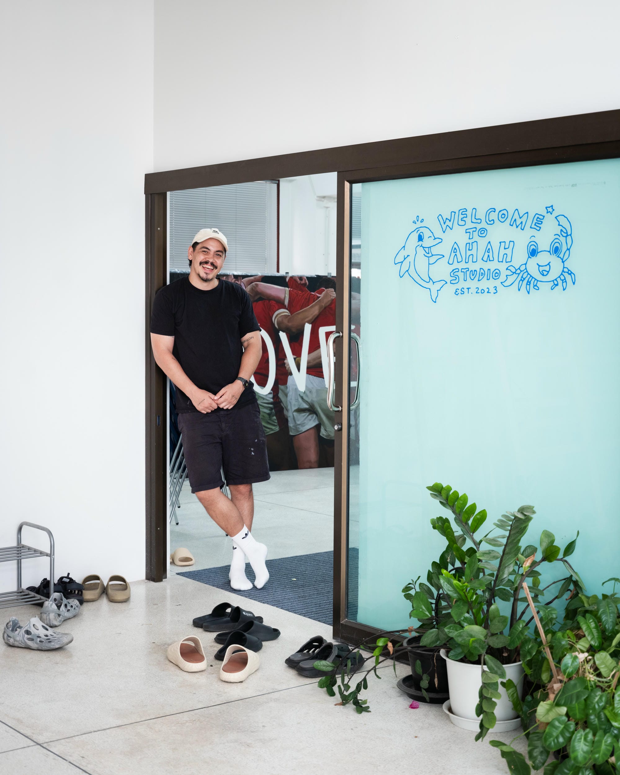 Abdul Abdullah standing in the doorway of Ahah Studio in Bangkok.